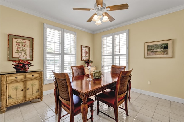 dining space featuring light tile patterned flooring, ceiling fan, and ornamental molding