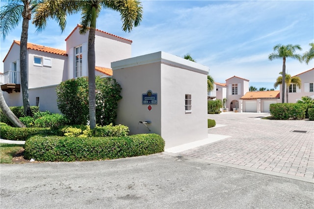 view of side of home featuring a garage