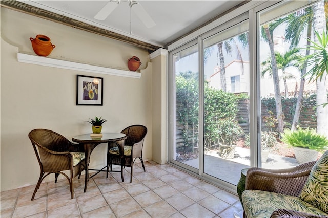 sunroom / solarium with plenty of natural light and ceiling fan