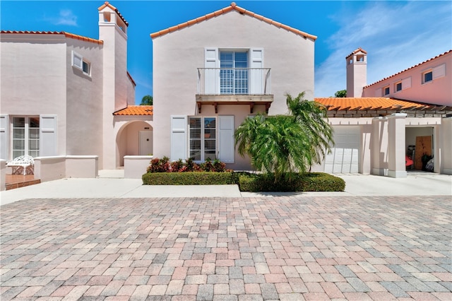 mediterranean / spanish-style house featuring a garage