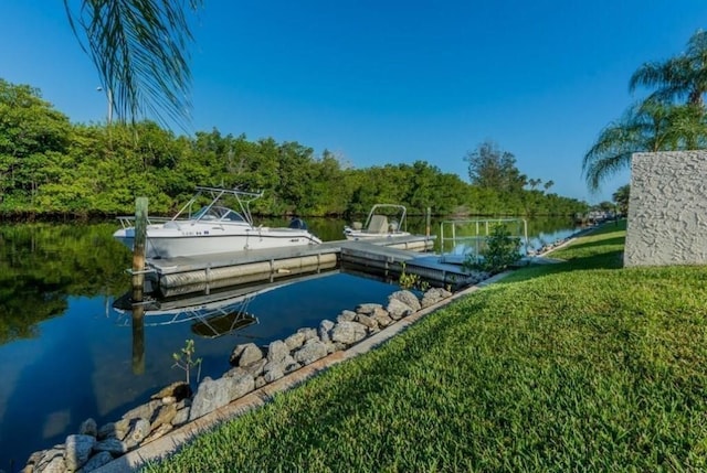 1845 Robalo Dr Unit 101D, Vero Beach, FL 32960 - dock with a water view and a yard