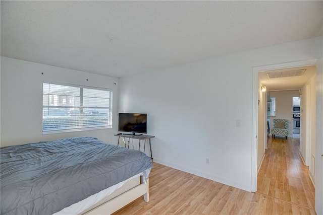 1845 Robalo Dr Unit 101D, Vero Beach, FL 32960 - bedroom with light wood-style flooring and baseboards