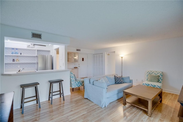 1845 Robalo Dr Unit 101D, Vero Beach, FL 32960 - living area with light wood finished floors