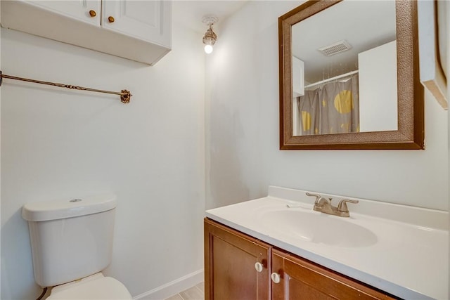 1845 Robalo Dr Unit 101D, Vero Beach, FL 32960 - bathroom featuring toilet, vanity, and a shower with shower curtain