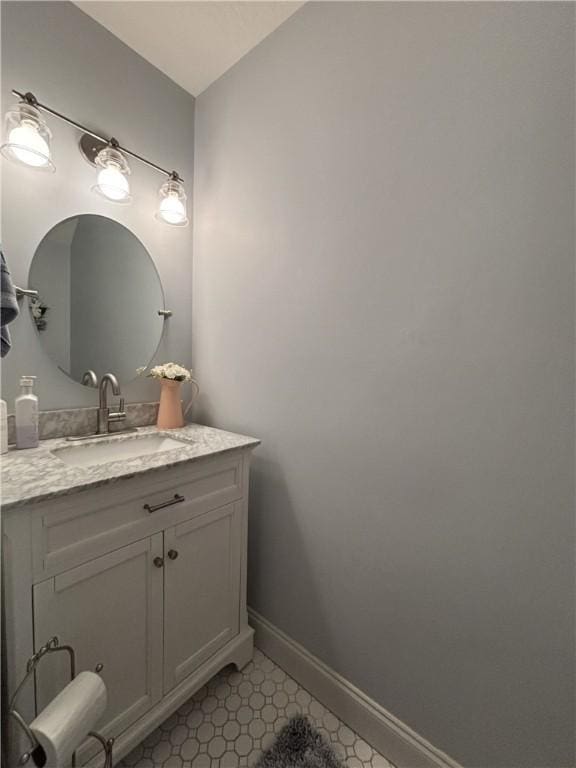 bathroom with vanity and vaulted ceiling