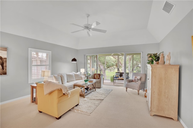 living room featuring light carpet, vaulted ceiling, and ceiling fan