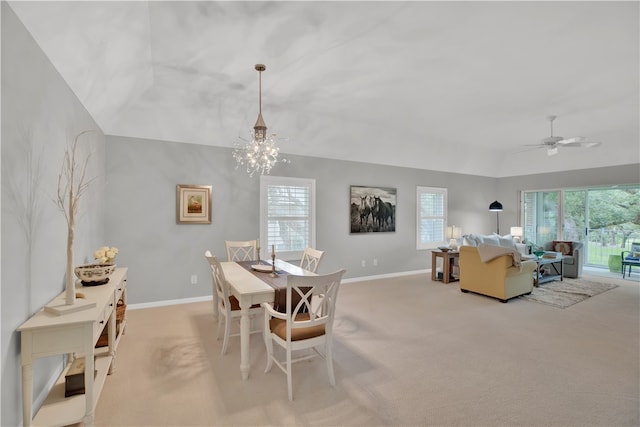 carpeted dining space featuring ceiling fan