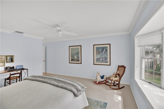 carpeted bedroom featuring ceiling fan and ornamental molding