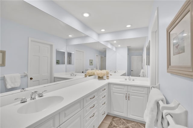 bathroom with tile patterned flooring and vanity