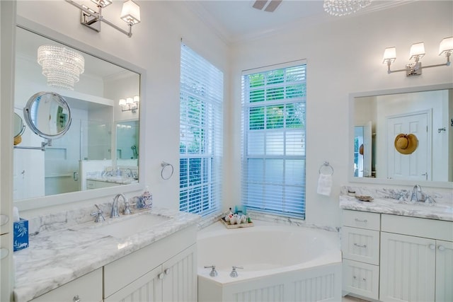 bathroom with vanity, ornamental molding, independent shower and bath, and a chandelier