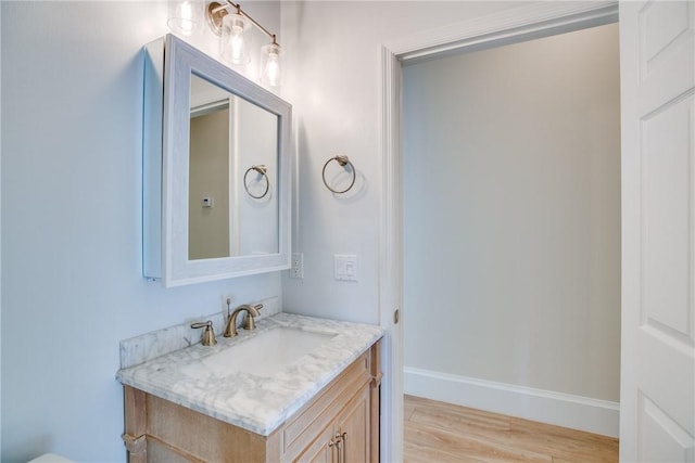 bathroom featuring hardwood / wood-style floors and vanity