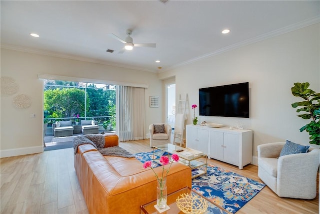 living room featuring ceiling fan, light hardwood / wood-style flooring, and ornamental molding