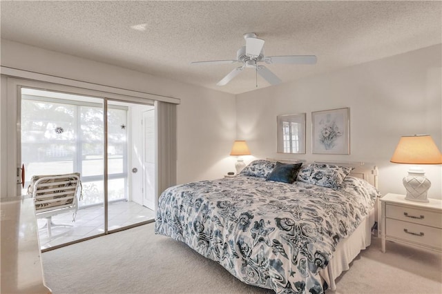 106 Spring Lake Ct Unit 207, Vero Beach, FL 32962 - bedroom with access to outside, light carpet, a textured ceiling, and ceiling fan