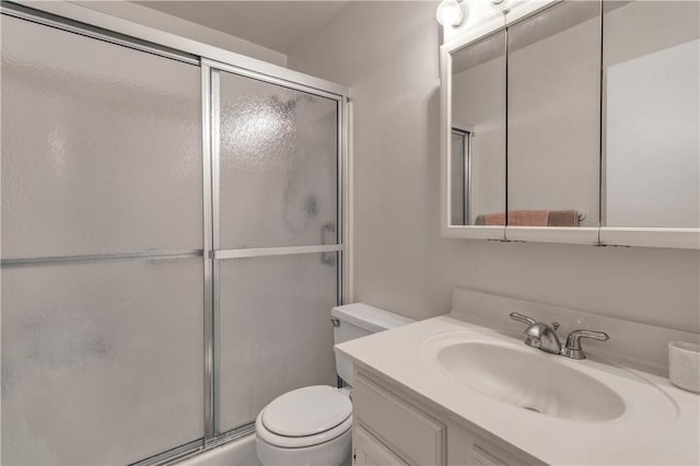 106 Spring Lake Ct Unit 207, Vero Beach, FL 32962 - full bath featuring a shower with shower door, vanity, and toilet