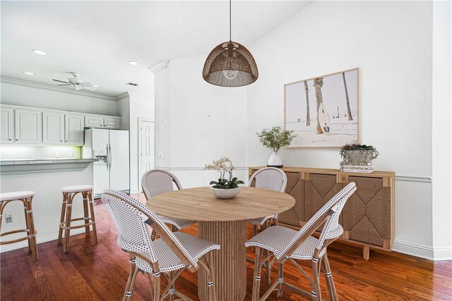 unfurnished living room featuring ceiling fan with notable chandelier, wood-type flooring, and lofted ceiling