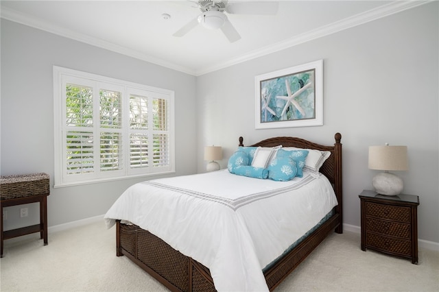 bedroom with crown molding, light carpet, and ceiling fan