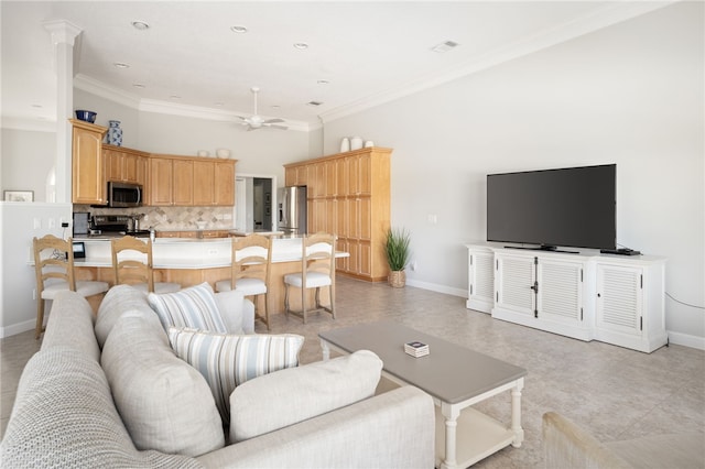 living room featuring ornamental molding and ceiling fan