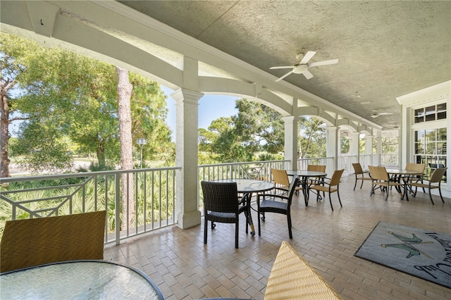 exterior space featuring ceiling fan