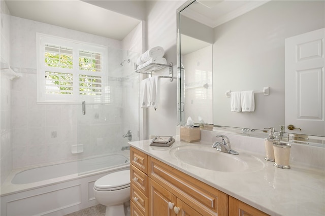 full bathroom featuring enclosed tub / shower combo, vanity, and toilet