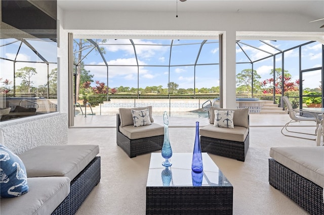 sunroom / solarium featuring ceiling fan