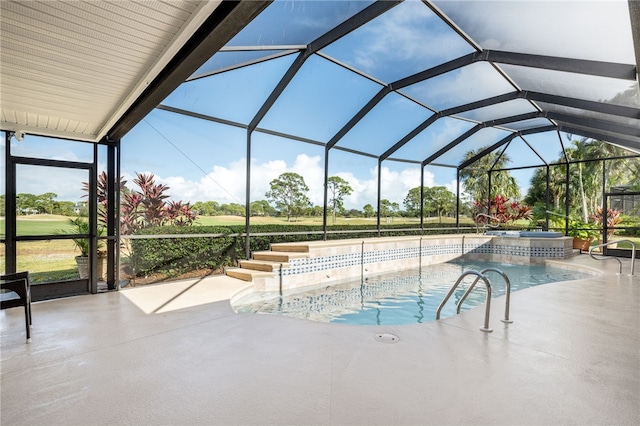 view of swimming pool with a patio and glass enclosure