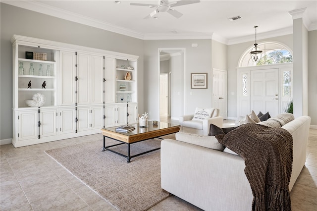 living room with crown molding, light tile patterned floors, and ceiling fan