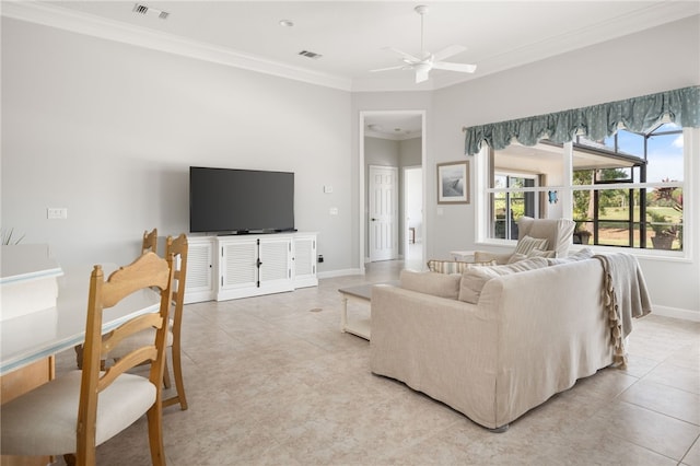 tiled living room with ornamental molding and ceiling fan