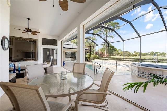 view of patio with a pool with hot tub, ceiling fan, and glass enclosure