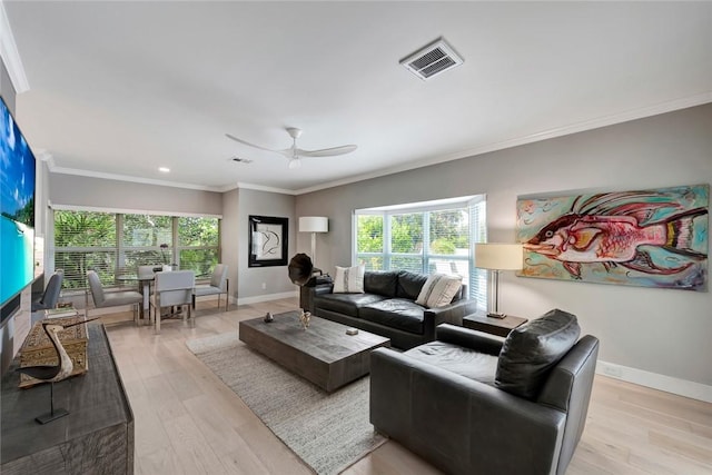 29 Cache Cay Dr, Vero Beach, FL 32963 - living room with healthy amount of natural light, light wood-style flooring, crown molding, recessed lighting, and a ceiling fan
