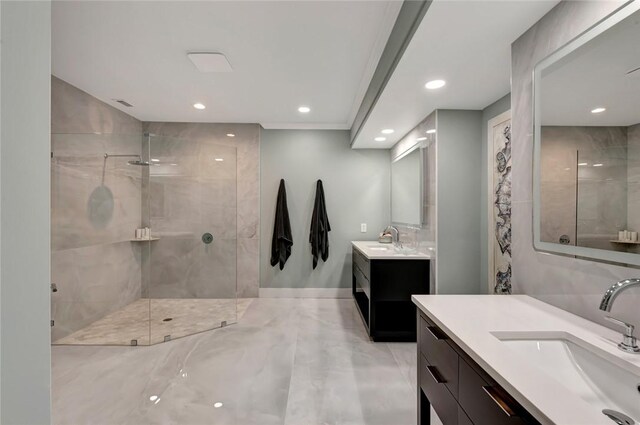 bathroom featuring a sink, recessed lighting, and a tile shower