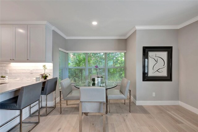29 Cache Cay Dr, Vero Beach, FL 32963 - dining space featuring light wood finished floors and ornamental molding