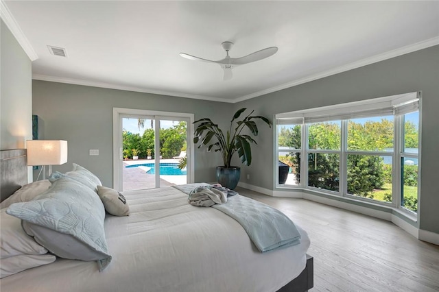 29 Cache Cay Dr, Vero Beach, FL 32963 - bedroom featuring access to exterior, ornamental molding, wood finished floors, and a ceiling fan