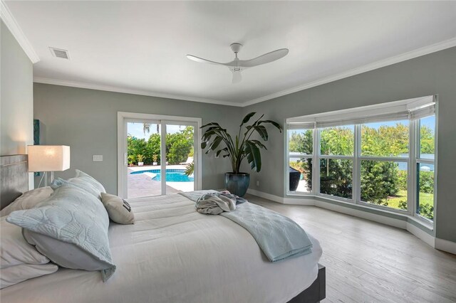 bedroom with access to exterior, ornamental molding, baseboards, and wood finished floors