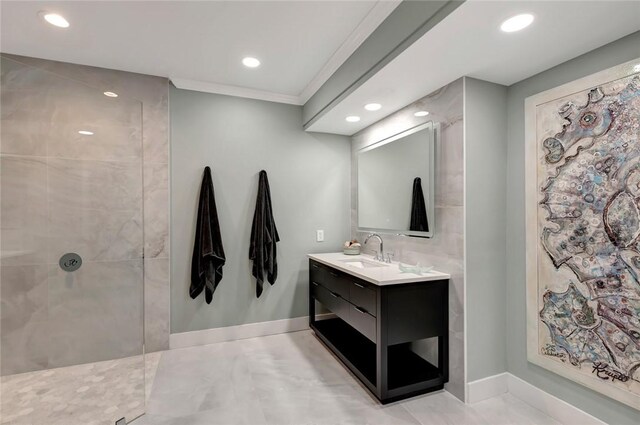 full bathroom featuring recessed lighting, baseboards, vanity, and walk in shower