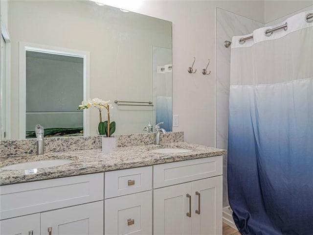 bathroom with vanity and a shower with shower curtain