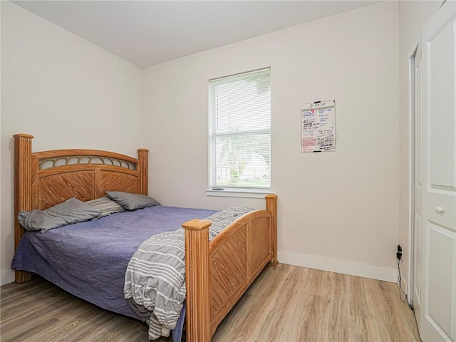 bedroom with light wood-type flooring