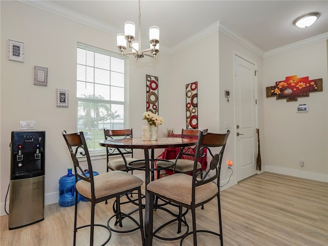 dining space with crown molding, light hardwood / wood-style flooring, a wealth of natural light, and an inviting chandelier