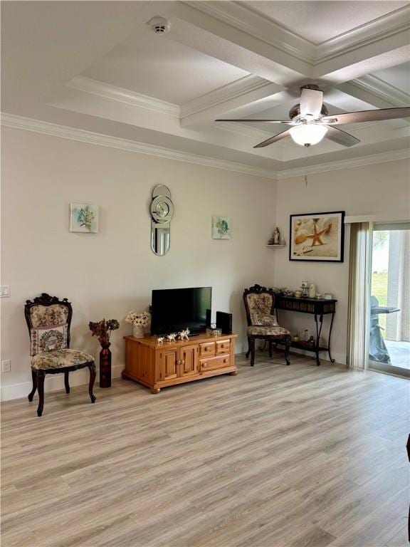 living area with crown molding, ceiling fan, and light wood-type flooring