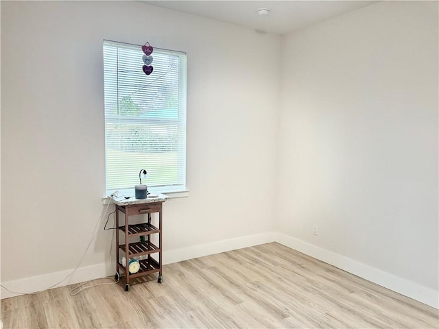 unfurnished room featuring light wood-type flooring