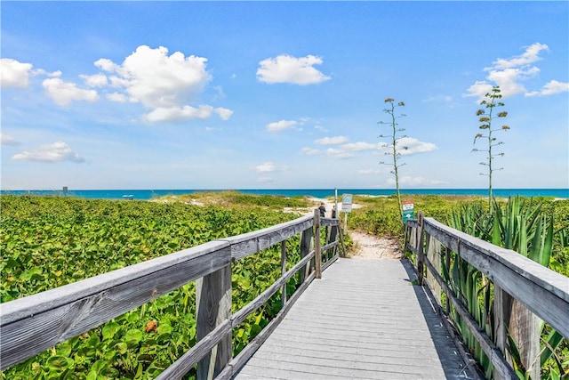 view of home's community featuring view of water and beach