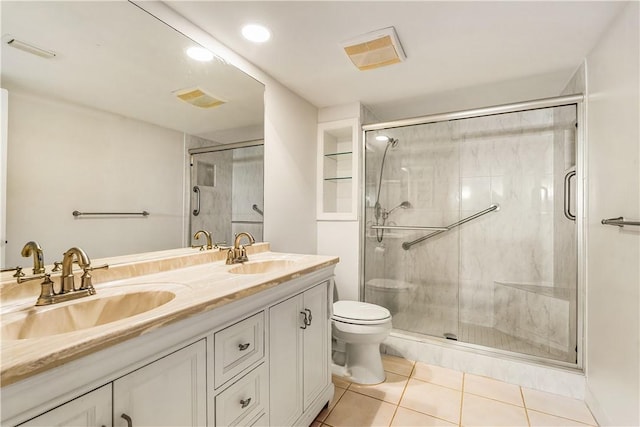 full bathroom with tile patterned floors, a stall shower, toilet, double vanity, and recessed lighting