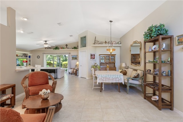 tiled dining room featuring ceiling fan and lofted ceiling