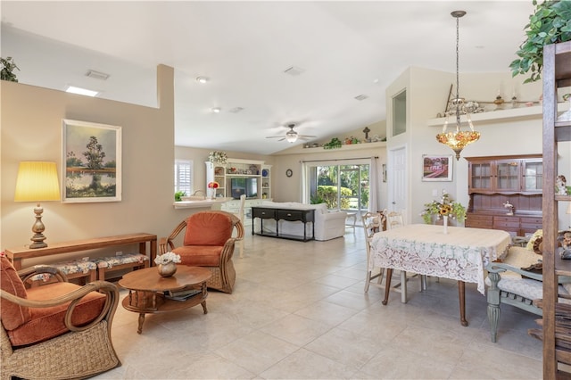 tiled dining room with vaulted ceiling and ceiling fan