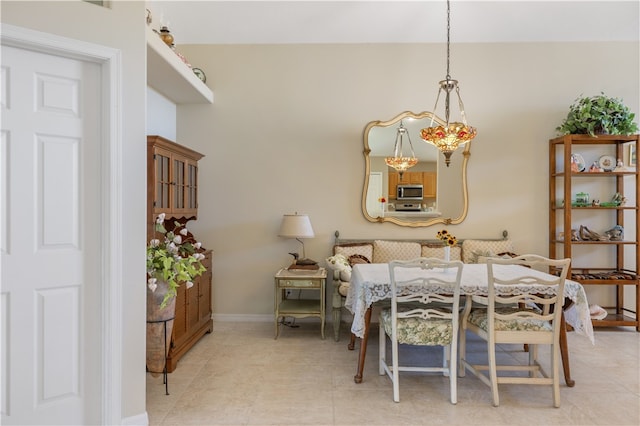 dining area featuring light tile patterned flooring