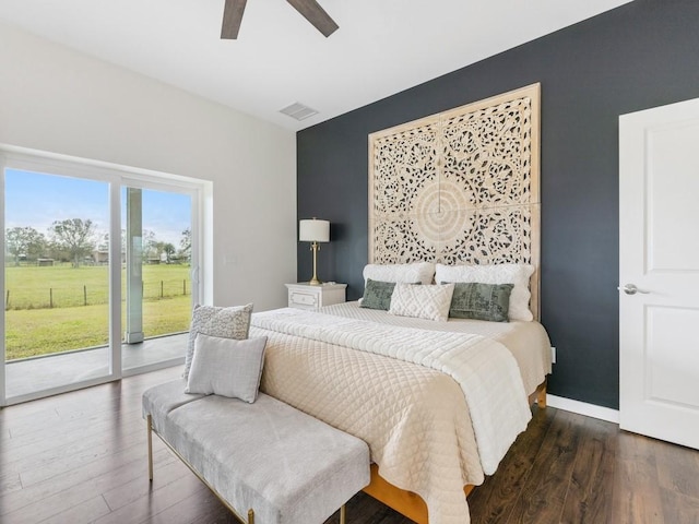 bedroom featuring access to exterior, dark hardwood / wood-style floors, and ceiling fan