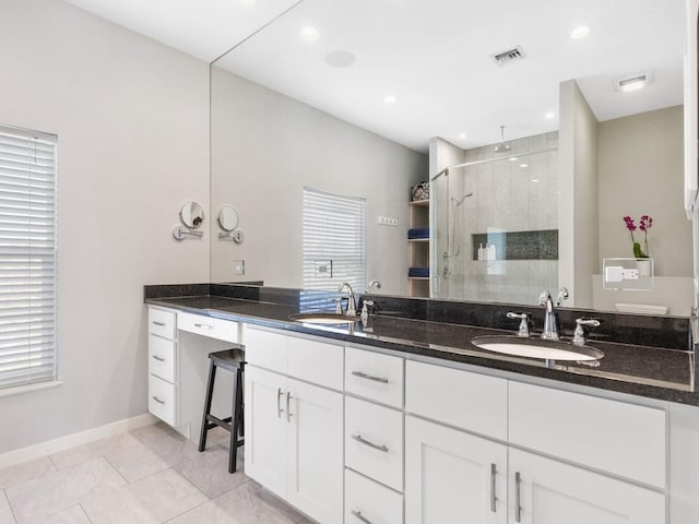 bathroom with vanity and an enclosed shower