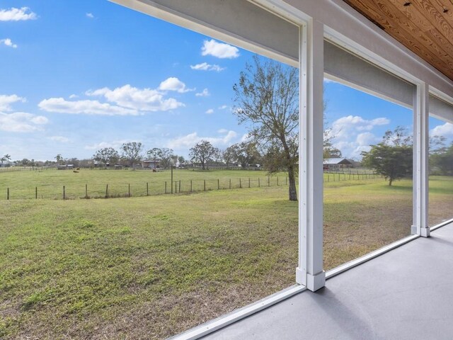 view of yard with a rural view