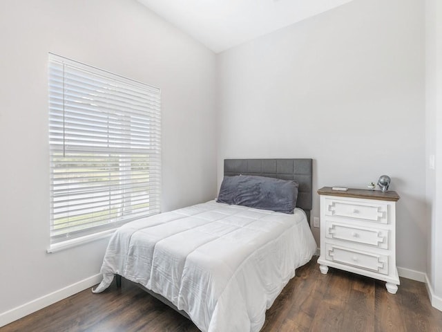 bedroom featuring dark hardwood / wood-style flooring