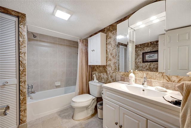 full bathroom featuring vanity, a textured ceiling, shower / bathtub combination with curtain, tile patterned flooring, and toilet