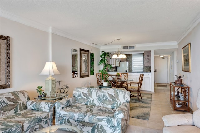 living room featuring a chandelier, light tile patterned floors, a textured ceiling, and crown molding